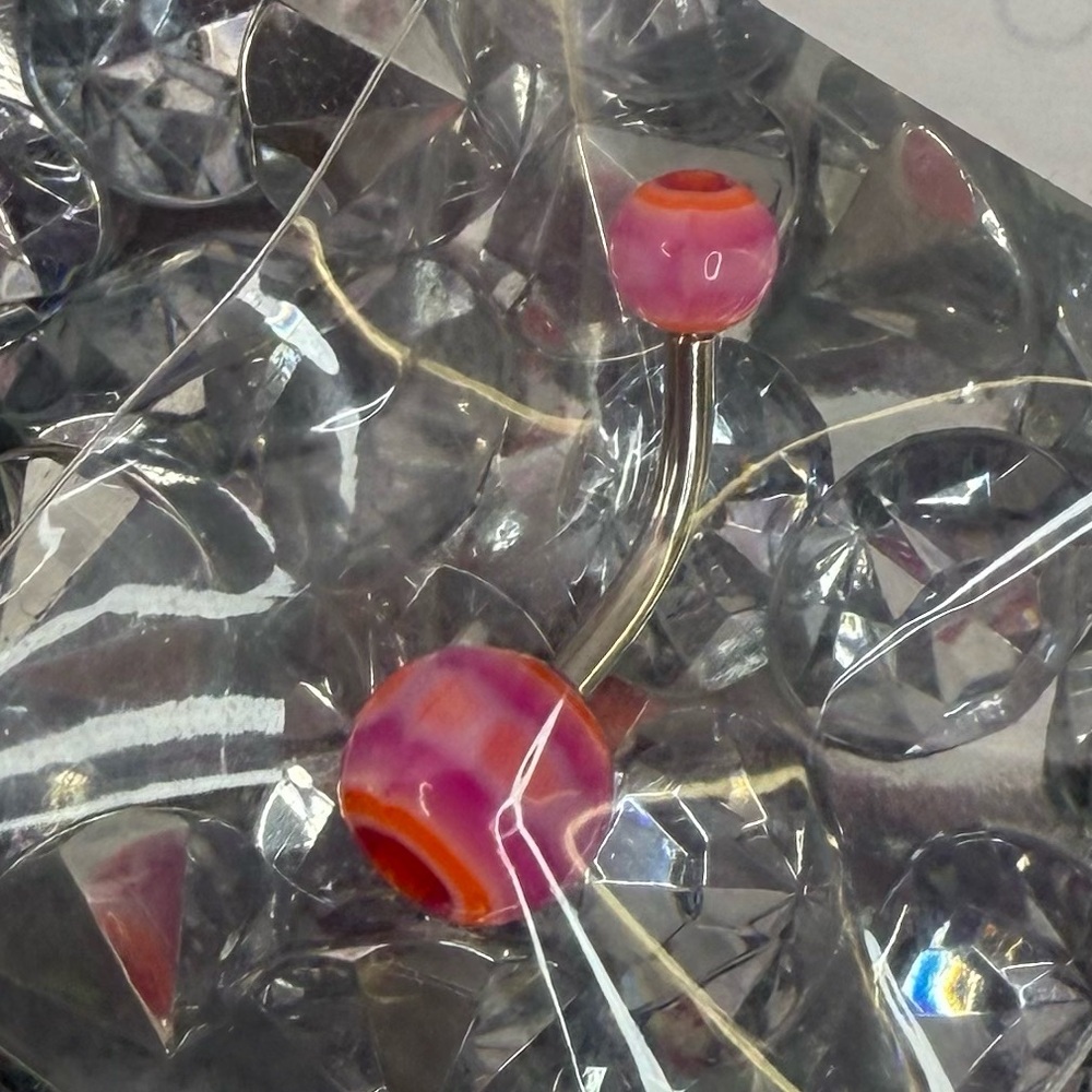 Bellybutton ring piercing brand new purple pink orange swirls